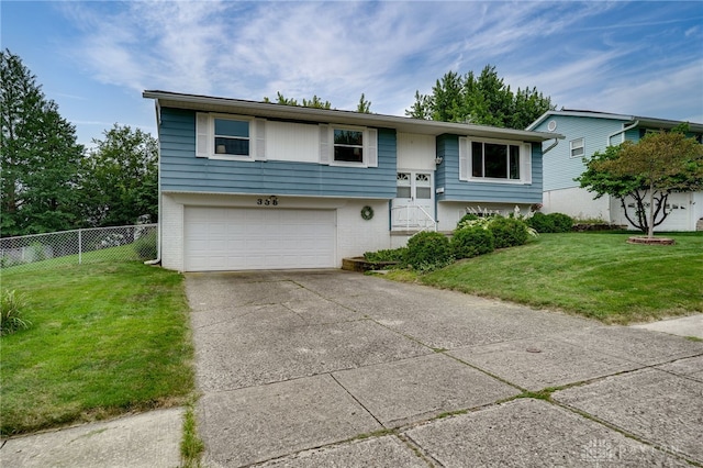 338 Chatham Dr, Fairborn, OH 45324 - bi-level home with brick siding, concrete driveway, and an attached garage