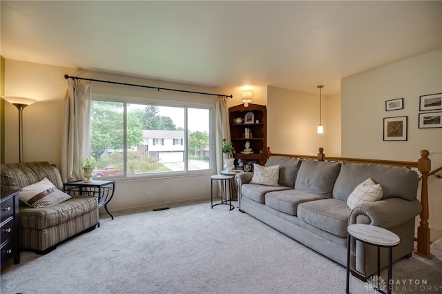 338 Chatham Dr, Fairborn, OH 45324 - carpeted living area featuring baseboards