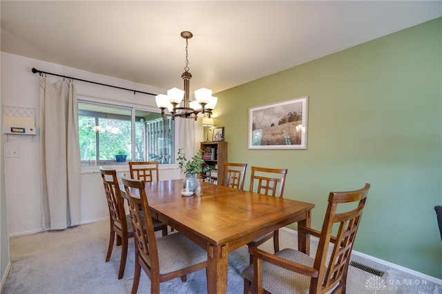 338 Chatham Dr, Fairborn, OH 45324 - dining room with a chandelier and light carpet