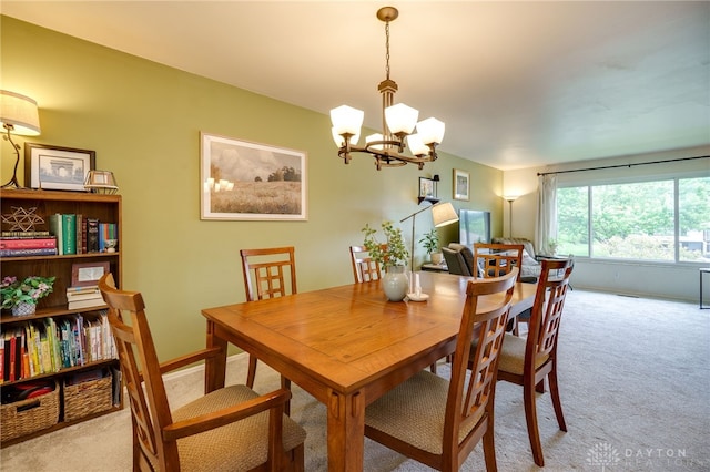 338 Chatham Dr, Fairborn, OH 45324 - dining area featuring light colored carpet and a chandelier