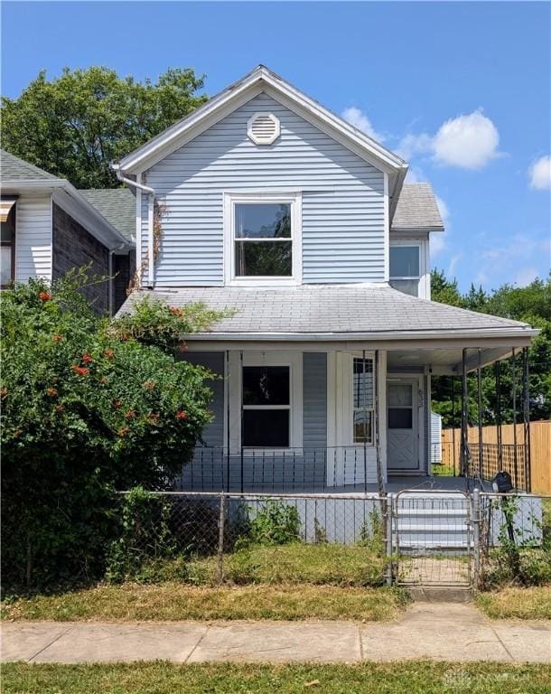 633 Taylor St, Dayton, OH 45404 - view of front facade featuring a porch, a fenced front yard, a shingled roof, and a gate