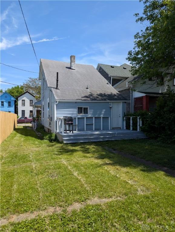 633 Taylor St, Dayton, OH 45404 - rear view of property with a chimney, a deck, and roof with shingles