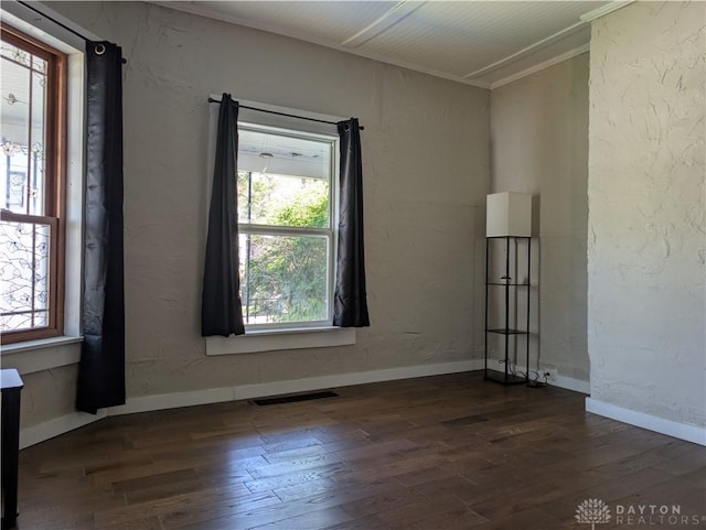 633 Taylor St, Dayton, OH 45404 - spare room featuring healthy amount of natural light and dark wood-style floors