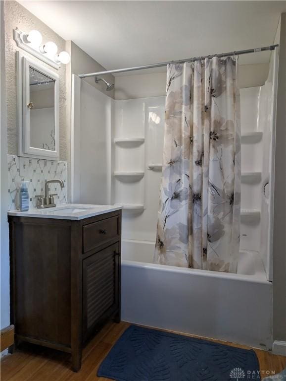 633 Taylor St, Dayton, OH 45404 - bathroom with wood finished floors, shower / tub combo, and vanity