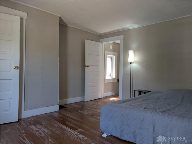 633 Taylor St, Dayton, OH 45404 - bedroom featuring wood finished floors and ornamental molding