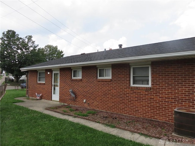2830 Kennedy Ave, Dayton, OH 45420 - back of property with brick siding, a lawn, and roof with shingles