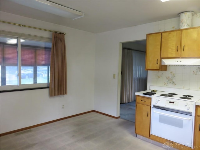 2830 Kennedy Ave, Dayton, OH 45420 - kitchen with white electric range, under cabinet range hood, light countertops, decorative backsplash, and light colored carpet