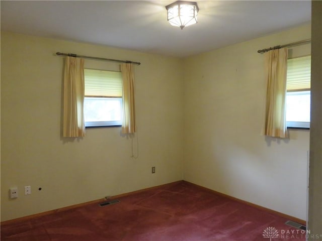 2830 Kennedy Ave, Dayton, OH 45420 - empty room featuring dark carpet and baseboards