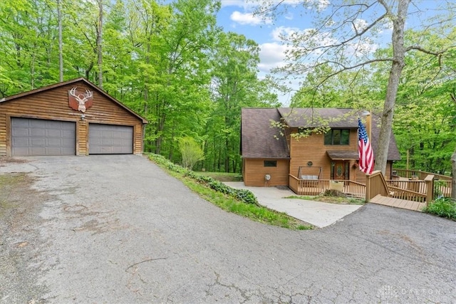 10370 Old 3c Hwy, Clarksville, OH 45113 - rustic home featuring a detached garage, a deck, an outbuilding, and roof with shingles
