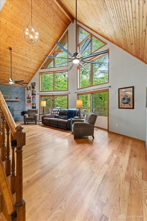 10370 Old 3c Hwy, Clarksville, OH 45113 - living area with ceiling fan, high vaulted ceiling, a wood ceiling with exposed beams, wood finished floors, and healthy amount of natural light