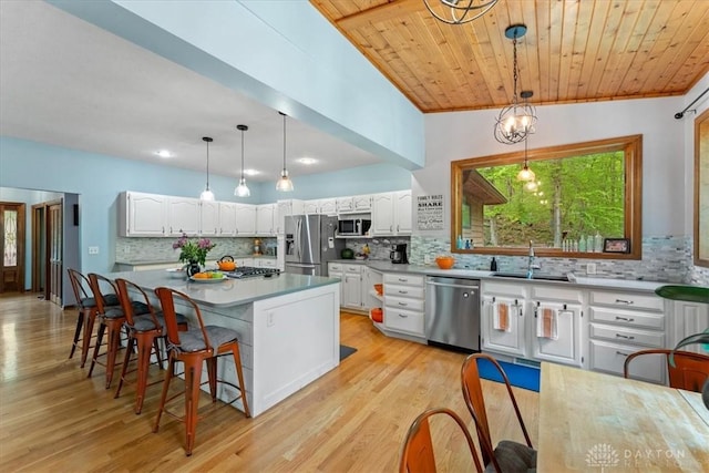 10370 Old 3c Hwy, Clarksville, OH 45113 - kitchen with appliances with stainless steel finishes, backsplash, white cabinets, and wooden ceiling