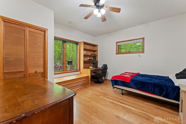 10370 Old 3c Hwy, Clarksville, OH 45113 - bedroom featuring light wood-style floors, a ceiling fan, a closet, and an office area