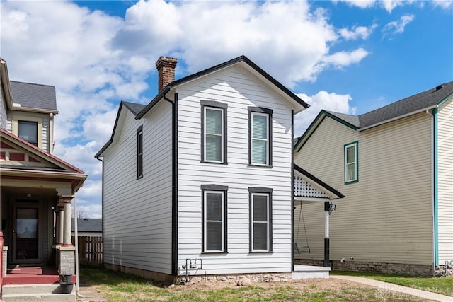 130 Mound St, Dayton, OH 45402 - view of front of property featuring a chimney and a front lawn