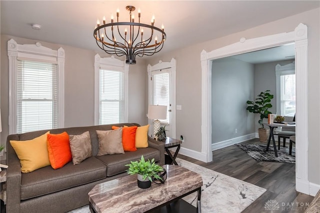 130 Mound St, Dayton, OH 45402 - living room with a chandelier and dark wood-style floors