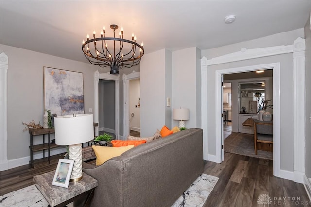 130 Mound St, Dayton, OH 45402 - living room featuring a chandelier and dark wood-style flooring