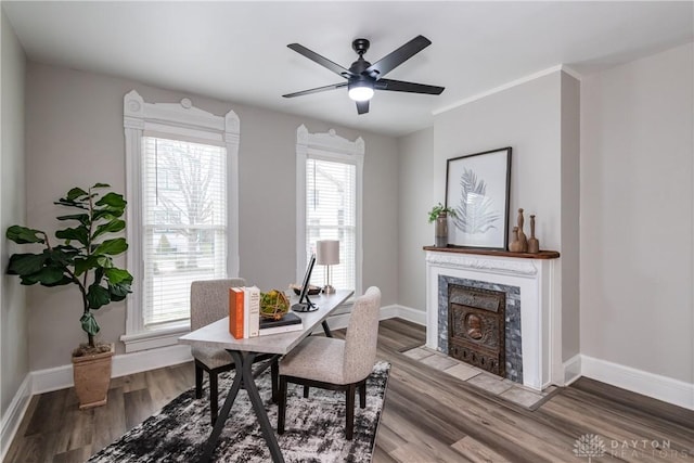 130 Mound St, Dayton, OH 45402 - dining room with wood finished floors, a fireplace, and ceiling fan