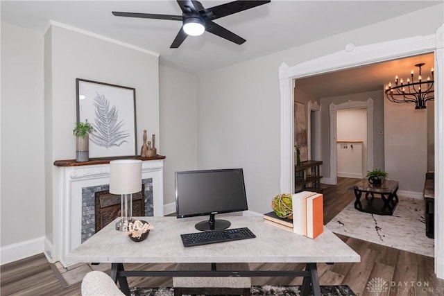 130 Mound St, Dayton, OH 45402 - office space with a fireplace, wood finished floors, a ceiling fan, and a chandelier