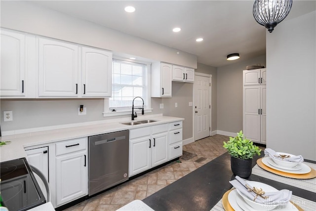 130 Mound St, Dayton, OH 45402 - kitchen with stainless steel dishwasher, black electric range oven, white cabinets, light stone finish floors, and recessed lighting