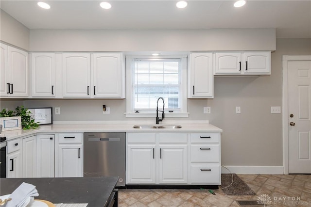 130 Mound St, Dayton, OH 45402 - kitchen featuring dishwasher, white cabinets, recessed lighting, and light countertops