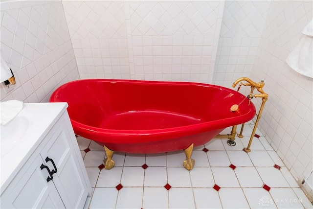 130 Mound St, Dayton, OH 45402 - bathroom featuring tile walls, vanity, and a freestanding tub