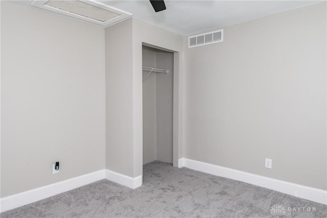 130 Mound St, Dayton, OH 45402 - unfurnished bedroom with carpet floors, a closet, a ceiling fan, and attic access