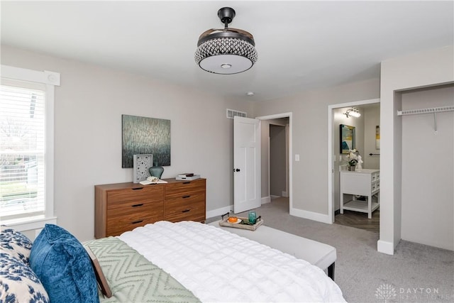 130 Mound St, Dayton, OH 45402 - bedroom featuring light carpet, multiple windows, and ensuite bath