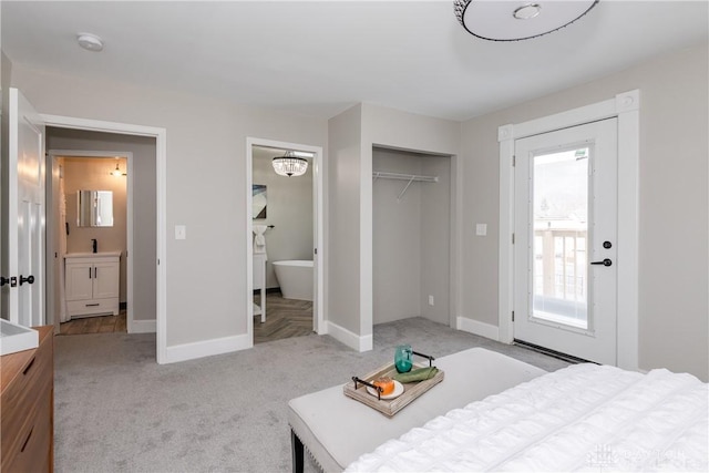 130 Mound St, Dayton, OH 45402 - bedroom featuring light carpet, a closet, and ensuite bath
