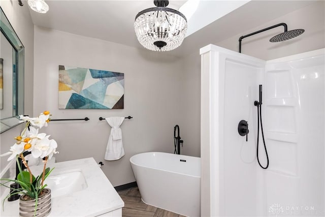 130 Mound St, Dayton, OH 45402 - bathroom with a walk in shower, vanity, a freestanding bath, and a chandelier