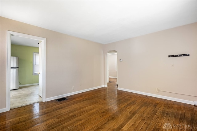 349 E Xenia Dr, Fairborn, OH 45324 - unfurnished room featuring hardwood / wood-style floors and arched walkways