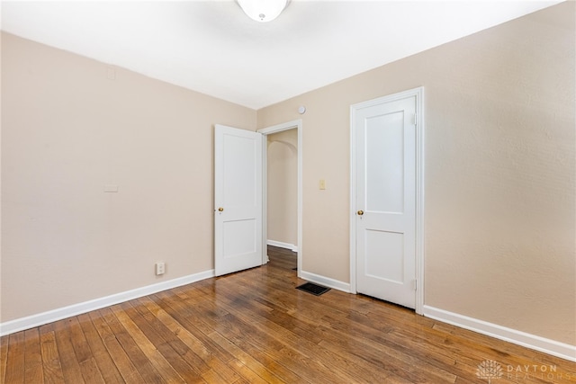 349 E Xenia Dr, Fairborn, OH 45324 - unfurnished bedroom featuring hardwood / wood-style floors and baseboards