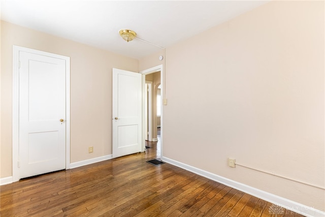 349 E Xenia Dr, Fairborn, OH 45324 - unfurnished bedroom featuring hardwood / wood-style floors and baseboards