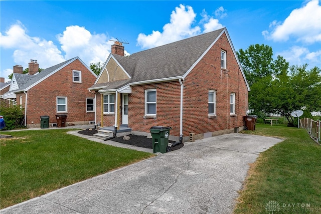 349 E Xenia Dr, Fairborn, OH 45324 - back of house featuring brick siding, a chimney, and roof with shingles