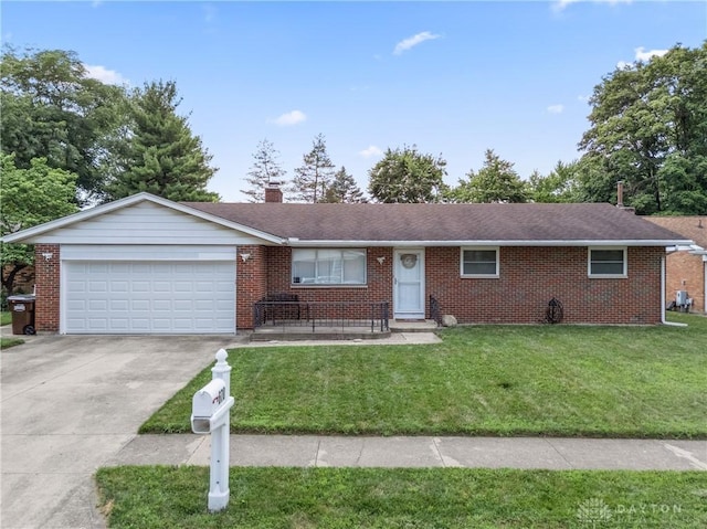 670 Saxony Dr, Xenia, OH 45385 - single story home with driveway, brick siding, a front lawn, and a garage