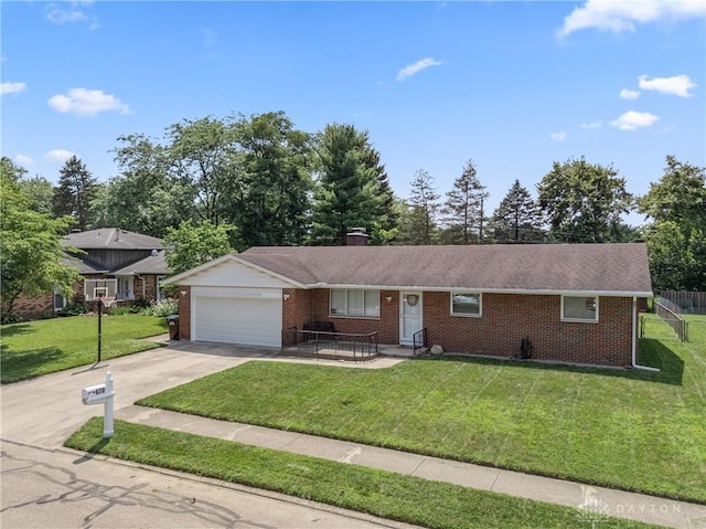 670 Saxony Dr, Xenia, OH 45385 - ranch-style home with brick siding, an attached garage, driveway, and a chimney