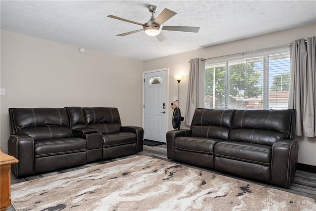670 Saxony Dr, Xenia, OH 45385 - living room featuring wood finished floors, ceiling fan, and a textured ceiling
