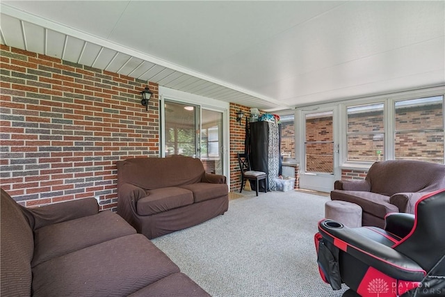670 Saxony Dr, Xenia, OH 45385 - living area with brick wall and carpet flooring