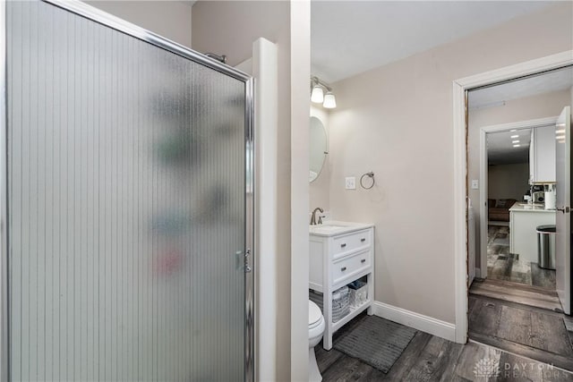 670 Saxony Dr, Xenia, OH 45385 - full bath with wood finished floors, a stall shower, and vanity