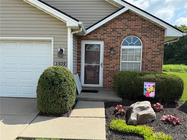 3509 Brian Ct, Middletown, OH 45044 - view of exterior entry featuring brick siding and an attached garage