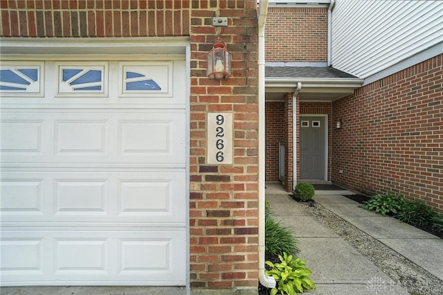 9266 Great Lakes Cir, Washington Twp, OH 45458 - property entrance with brick siding and roof with shingles