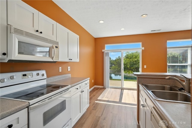 9266 Great Lakes Cir, Washington Twp, OH 45458 - kitchen with white appliances, light countertops, and white cabinets