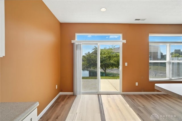 9266 Great Lakes Cir, Washington Twp, OH 45458 - doorway featuring light wood-style flooring, healthy amount of natural light, and recessed lighting