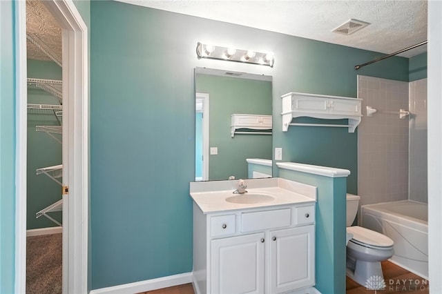 9266 Great Lakes Cir, Washington Twp, OH 45458 - bathroom featuring vanity, a textured ceiling, bathing tub / shower combination, and a spacious closet