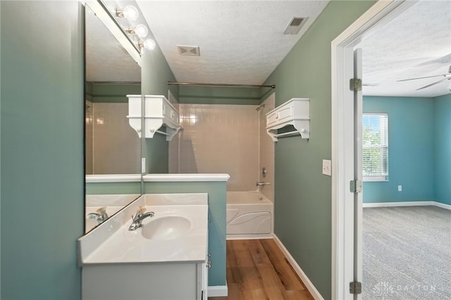 9266 Great Lakes Cir, Washington Twp, OH 45458 - full bathroom with vanity, shower / tub combination, a textured ceiling, and ceiling fan