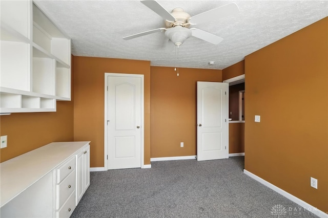 9266 Great Lakes Cir, Washington Twp, OH 45458 - unfurnished bedroom with dark colored carpet, a textured ceiling, and ceiling fan