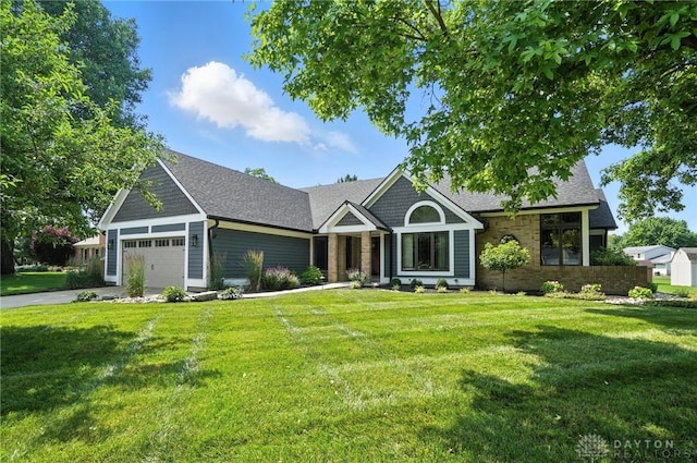 95 Sycamore Creek Dr, Springboro, OH 45066 - view of front facade with a front yard, an attached garage, concrete driveway, and a shingled roof