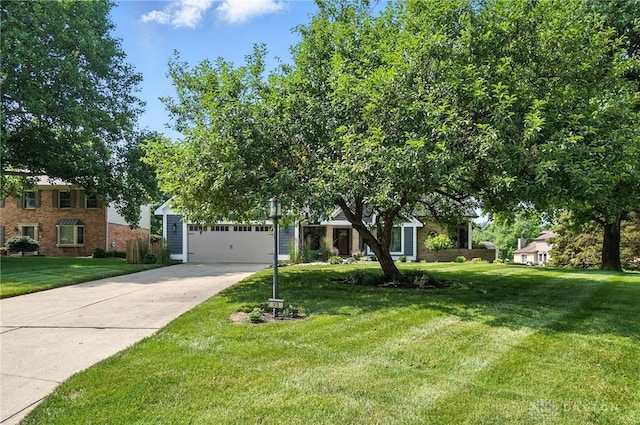 95 Sycamore Creek Dr, Springboro, OH 45066 - obstructed view of property featuring driveway, a front lawn, and a garage