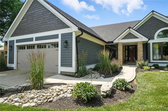95 Sycamore Creek Dr, Springboro, OH 45066 - craftsman-style house with an attached garage, concrete driveway, a front yard, and roof with shingles