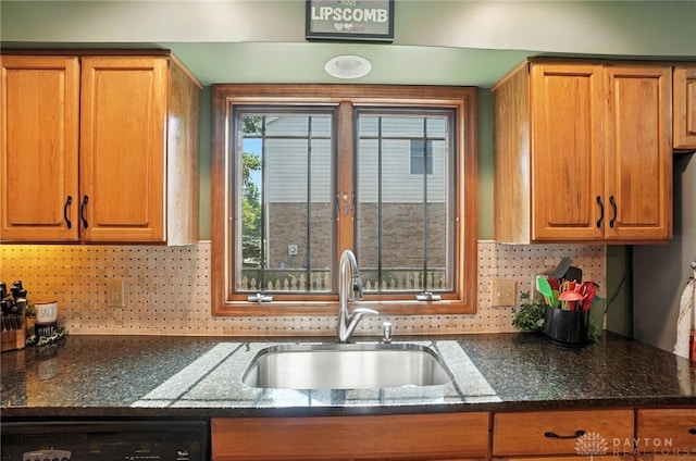 95 Sycamore Creek Dr, Springboro, OH 45066 - kitchen featuring dark stone counters, dishwasher, and tasteful backsplash