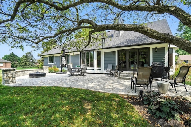 95 Sycamore Creek Dr, Springboro, OH 45066 - rear view of house with french doors, a fire pit, a lawn, a patio area, and a shingled roof
