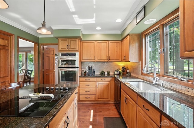 95 Sycamore Creek Dr, Springboro, OH 45066 - kitchen with black appliances, wood finished floors, dark stone countertops, ornamental molding, and backsplash